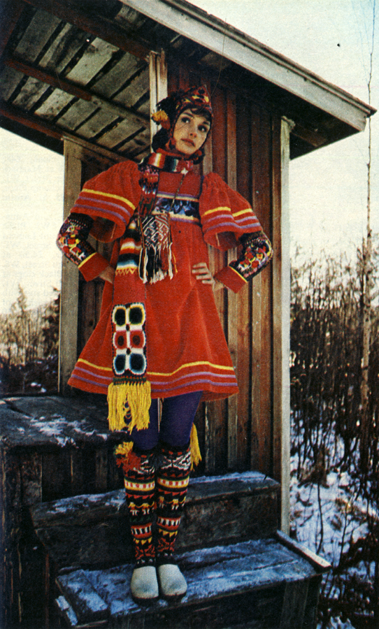 Red velvet smock by Jap and socks, helmet, armbands, bag and scarf from Inca