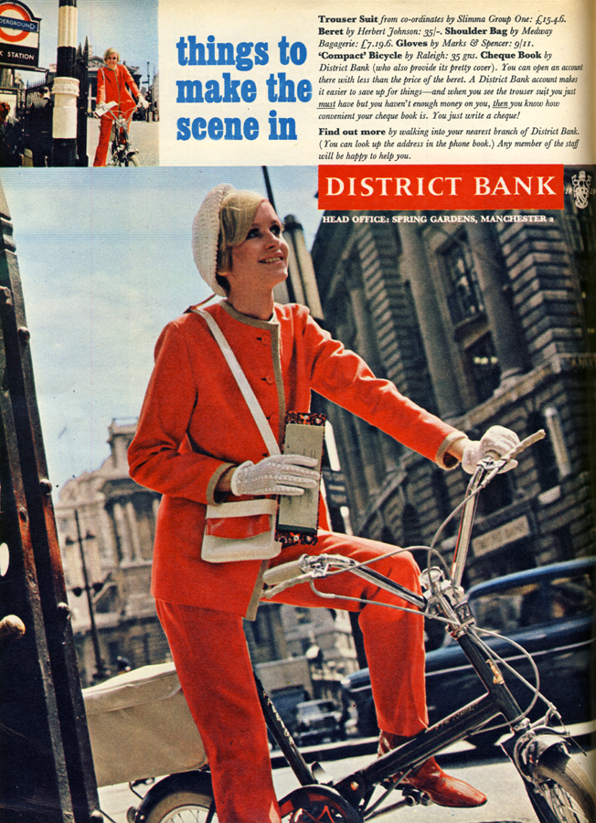 Trouser suit by Slimma Group One, hat by Herbert Johnson, gloves by Marks and Spencer, 'Compact' bicycle by Raleigh, cheque book by District Bank