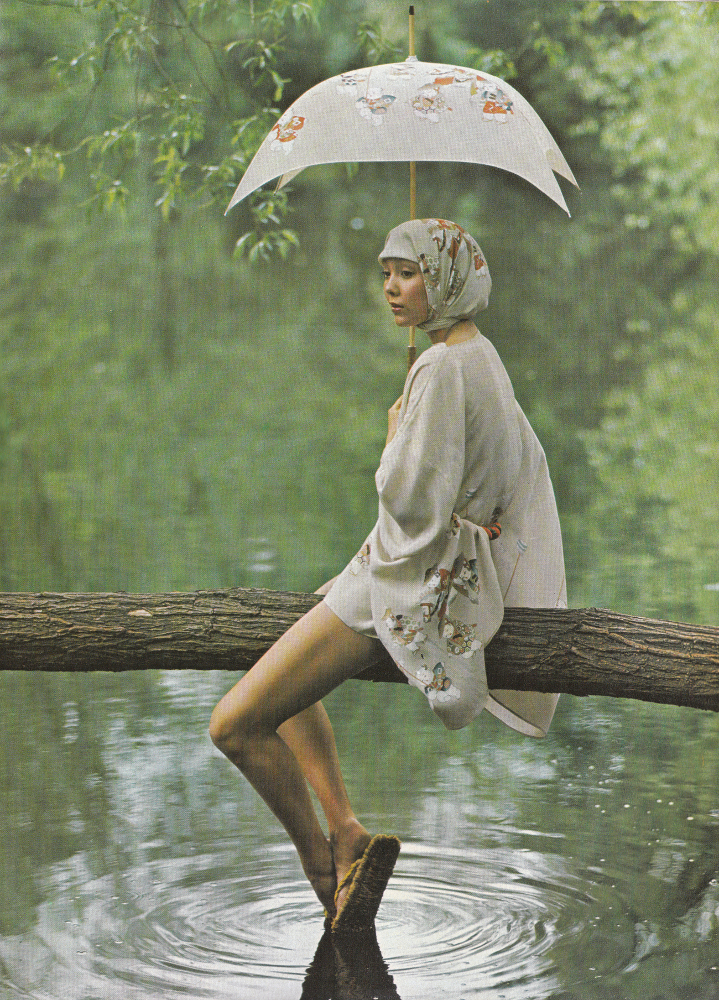 ...in a leafy glade - the green and woody scent of Coty's Emeraude. Short beige silk kimono, £35, scarf, £8, printed with figures by Kansai Yamamoto, matching umbrella by Kanei Orimono, £5 from Boston-151. 