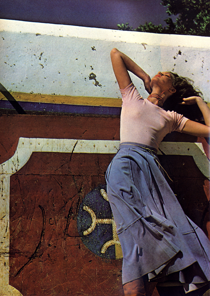 Swirly skirt in lilac suede from Patti Searle. Cotton t-shirt in pale pink by Sun and Sand. Tan leather boots by Mary Graeme.