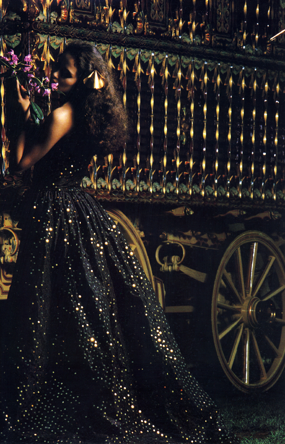 Black silk taffeta dress with gold sequins hand embroidered with a matching gathered overskirt open at the front (The dress can be worn alone, the overskirt as a cape) £1150 from Emanuel