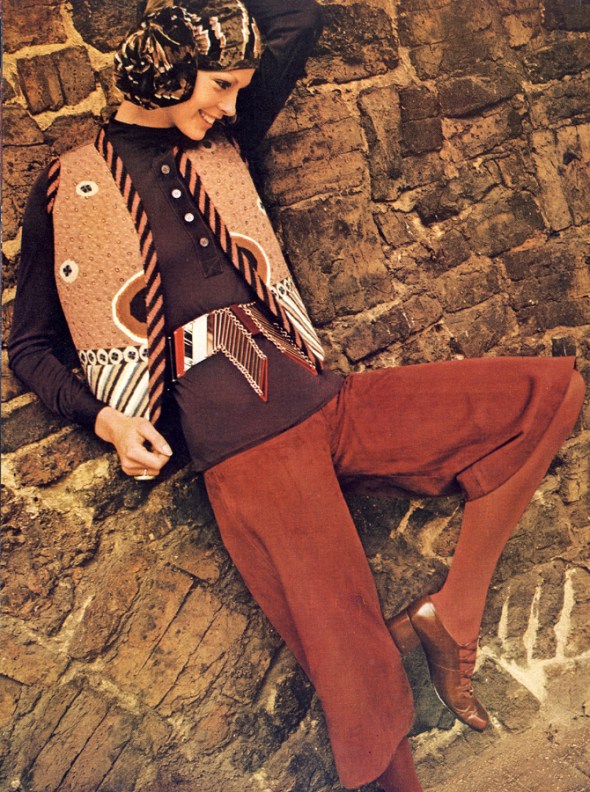 Needlepoint waistcoat by Kaffe Fassett for Beatrice Bellini, £25 to order, Women's Home Industries' Tapestry Shop. Suede gauchos, fine jersey shirt, both by JEan Muir. Perspex belt by Nigel Lofthouse for Jean Muir. Chillies Christel at Elliott. Panne velvet muffler by Veronica Marsh for Jacqmar.