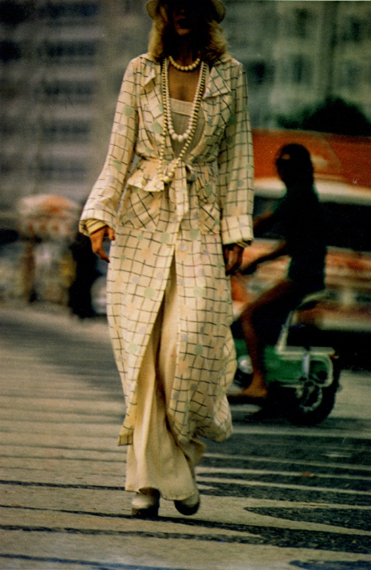 Crêpe de chine printed coat and plain crêpe bags from Electric Fittings. Rib sun top by John Craig. Pique sun hat by Edward Mann. Espadrilles at Ronald Keith.