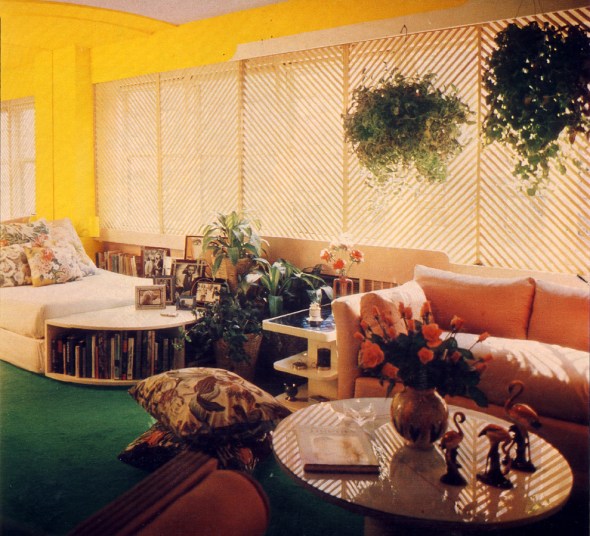 Latticed windows in the living room let in lots of light. A gallery of favourite photos and a vaseful of roses add film-star glamour.