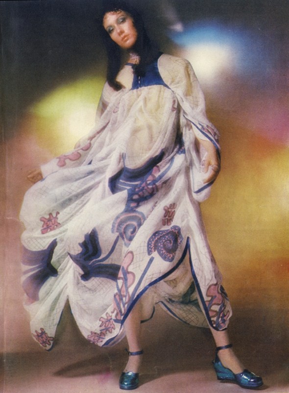 Printed silk chiffon looped into a skirt, gathered from a tiny blue satin bodice, with blue satin ribbon at hem. By Zandra Rhodes, £89, at Fortnum & Mason. Tiered metallic platform shoes, 9gns, at Rowley & Oram of Kensintyon Market. Beaded choker, by Bibette, from range at Thea Porter. Rings from Hope and Eleanor, Chelsea Antique Market.