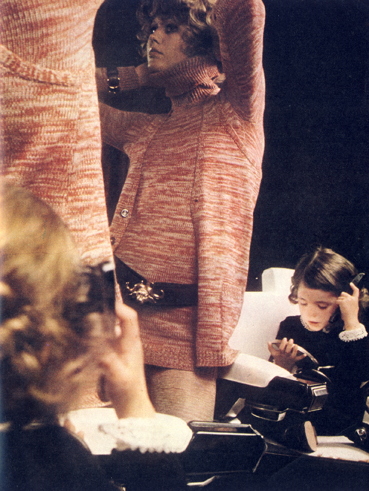 Marled knit polo neck sweater with sleeveless waistcoat by Biba. Leather belt by Cerruti. 