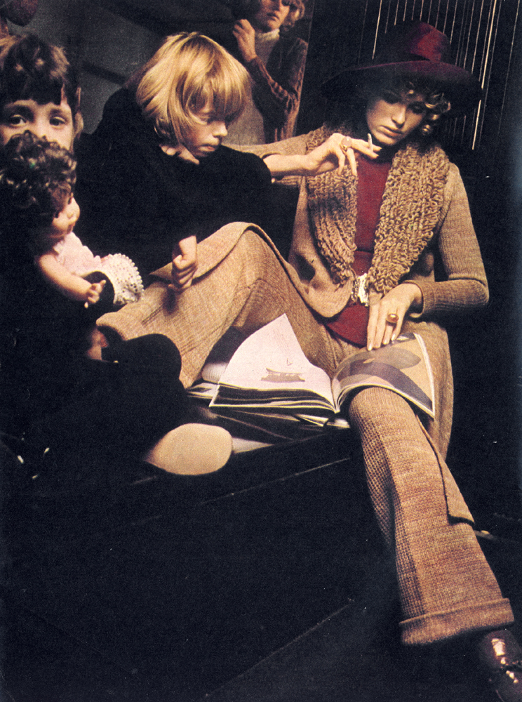 Maxi coat and trousers knitted by Women's Home Industries. Roll neck sweater dress by Virginia. Hat by Cerruti.