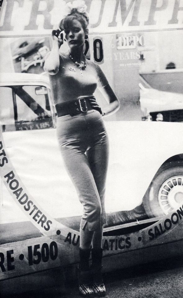 Short sleeved pale lilac sweater by Beckol from Chelsea Girl. Silvery-grey cotton pedal pushers by Antony Price from Che Guevera. Red, white and blue tartan shoes from Zapata. Wide red elasticated belt by Otto Glantz.