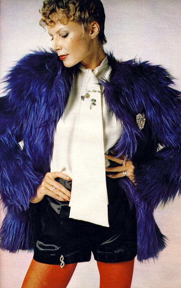 Square shouldered shaggy jacket by Sheridan Barnett for Simon Massey. Slippery sati shorts from Martha Hill. Floppy crepe de chine by John Craig. Butterfly brooch by Adrien Mann. Other jewellery by Bus Stop.