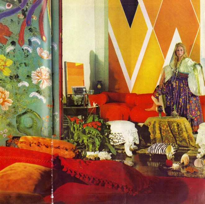 The living room with Jane Holzer in gipsy dress with ribbon-swagged sleeves and wildly flowered skirt by Sant'Angelo; an 18th-century Chinese screen, thirteenfoot high and covered with precious bird and flower paper; white iron lace stools first ordered by Queen Victoria from her Indian Empire; Larry Zox's vast 1968 abstract; a low table of polished petrified wood with a collection of coral and sea creatures shells, and, in front, Mrs Holzer's own design for the sofa, several suede pillows thrown accurately at random.
