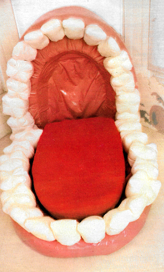 A false teeth sofa, with a soft and life-like tongue for some idle lounging.