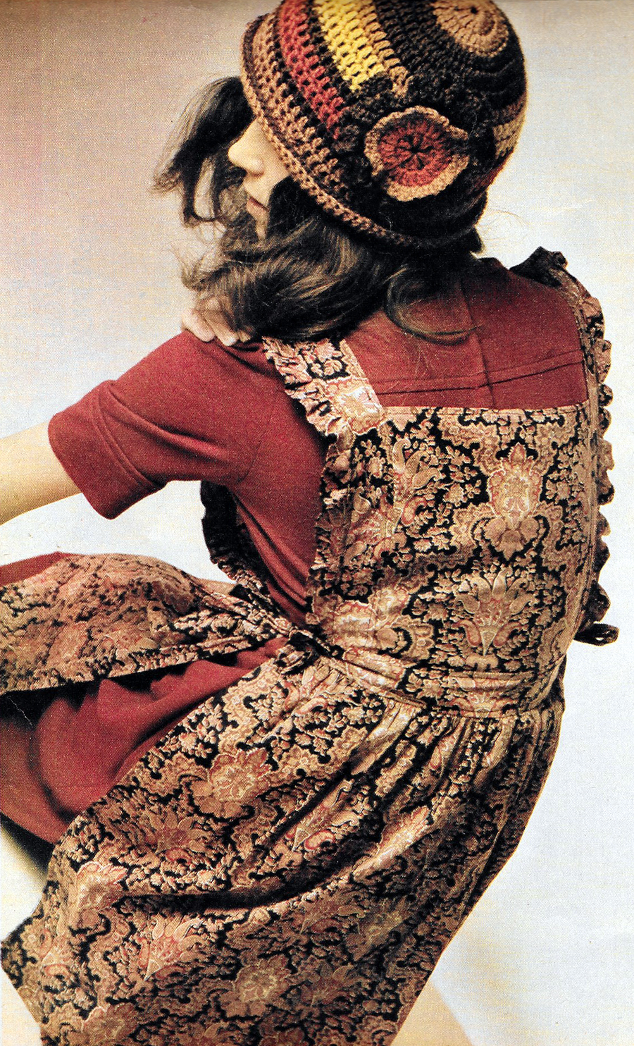 Jersey midi dress by Crowthers. Paisley pinafore by Angela. Knitted hat by Susan Locke.