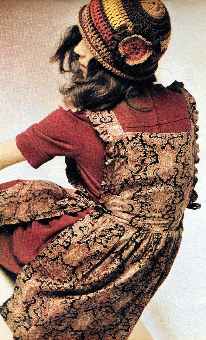 Jersey midi dress by Crowthers. Paisley pinafore by Angela. Knitted hat by Susan Locke.
